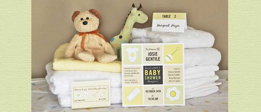 invitations, party favour and name tag displayed with toys