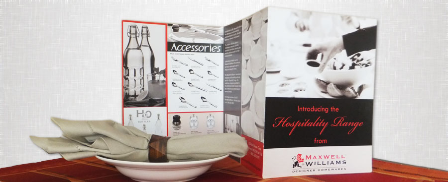  folded brochure with dishes, cutlery, glasses grey and black